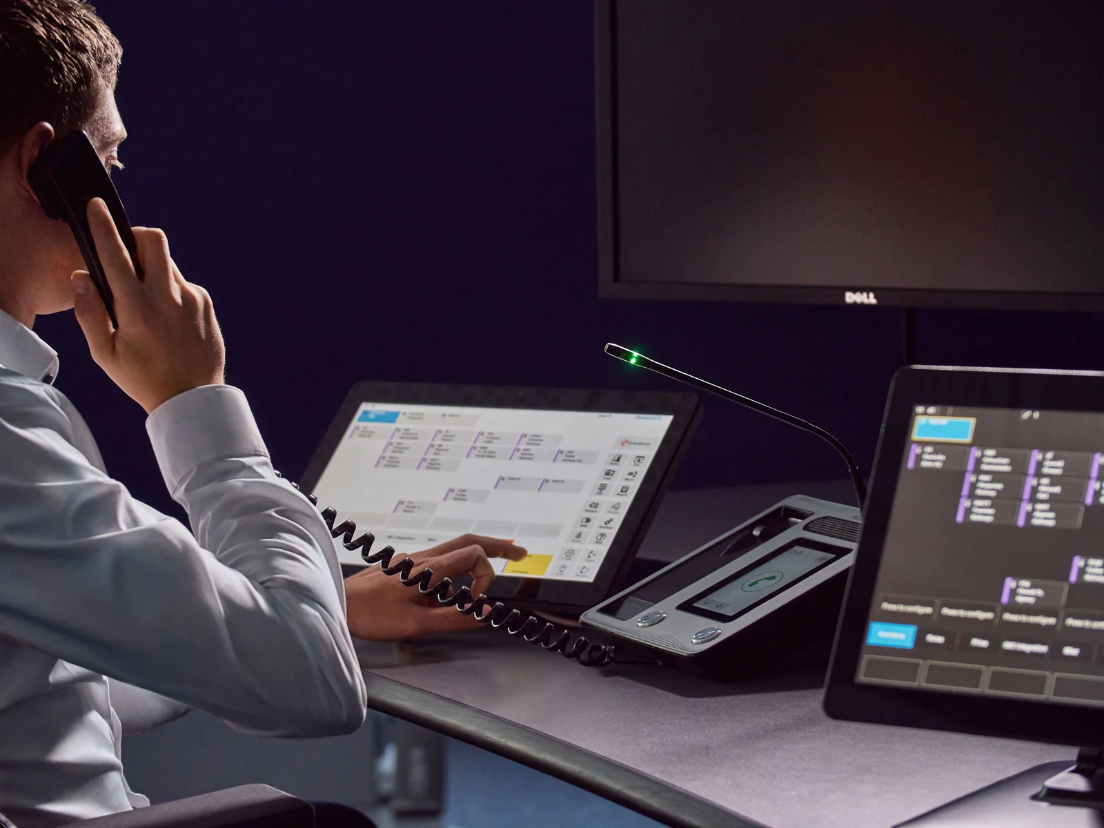 Professional dispatch center controller headshot retouching showing operator speaking on the phone in a control room